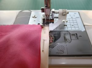 Use of a blind foot (?) to get stitching an even distance from the edge of the binding