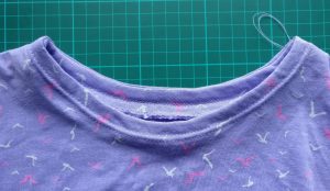 Twin Needle Topstitching Around the Neckline. Also Used for the Sleeve and Main Body Hems